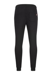 Μαύρο παντελόνι jogger στενής γραμμής με ελαστική μέση, μανσέτες στους αστραγάλους και μία πίσω τσέπη με μικρή σημαία ως λεπτομέρεια.