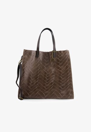 Brown leather tote bag with woven pattern, dual top handles, and detachable strap. Features a chain accent and contrasting stitching.