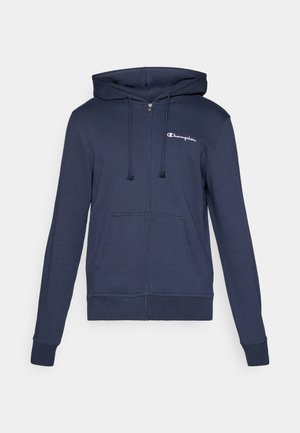 Navy blue zip-up hoodie made of soft material, featuring a kangaroo pocket, ribbed cuffs, and a white Champion logo on the chest.