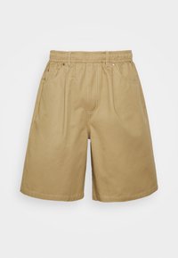 Pantaloni corti khaki con cintura elastica, due tasche laterali e cuciture piatte. Realizzati in tessuto di cotone, caratterizzati da una superficie liscia.