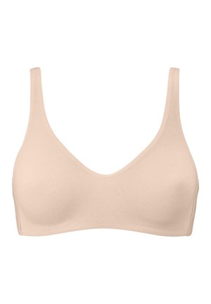 Beige draadloze bh gemaakt van zachte, gladde stof; beschikt over brede banden en een ronde halslijn; naadloos ontwerp biedt een lichte uitstraling.