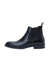 Botas Chelsea de cuero negro con paneles laterales elásticos y una lengüeta, con un acabado suave y un tacón bajo apilado.
