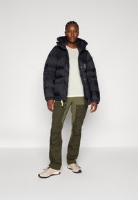 Fjällräven EXPEDITION DOWN LITE JACKET W - Gewatteerde jas - black