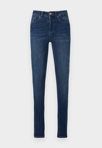 Sötétkék farmer skinny nadrág magas derékkal, öt zsebbel és finom kopással a csípőnél. Klasszikus varrás és fém gomb.