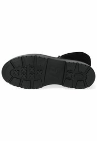 Black rubber outsole with deep tread pattern, featuring various textured grips for traction. Solid construction with a smooth, durable finish.