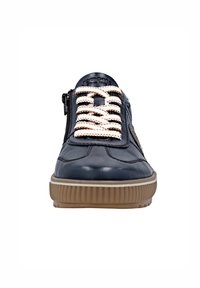 Navy leather sneaker with textured rubber sole, featuring white laces and a zip closure on the side for easy access.