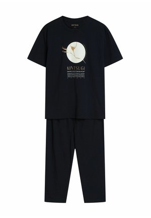 Czarny bawełniany zestaw piżamowy z krótkim rękawem, z nadrukiem w kształcie koła i złotymi akcentami na górze. Spodnie o luźnym kroju.