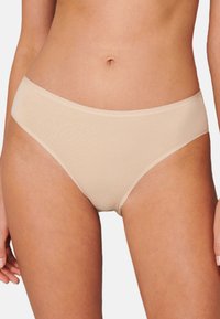 Beige puuvillasekoitteesta valmistetut bikinit, joissa on sileä pinta, keskikorkea vyötärö ja näkymättömät saumat saumattoman istuvuuden takaamiseksi.