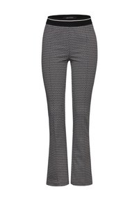 Women's black and white zigzag patterned pants with a black elastic waistband featuring a white stripe.