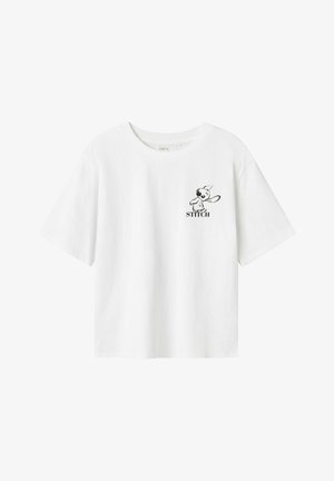 T-shirt blanc à manches courtes en coton. Présente un graphique noir d'un personnage avec le texte "STITCH" en dessous sur le côté gauche de la poitrine.