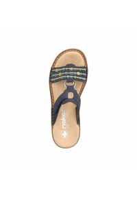 Navy blue sandal with multicolored woven straps, circular metal ring, and cushioned beige footbed. Contains logo on footbed.