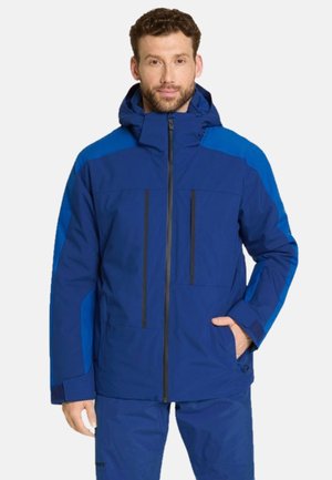 Veste isolante bleu marine avec fermeture éclair sur le devant, deux poches poitrine et accents contrastants bleu clair sur les manches et les épaules. Design à capuche.