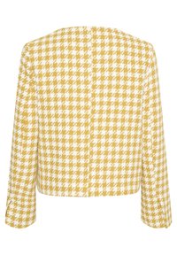 Avkortad jacka med ett gult och vitt hundstooth-mönster, texturerad tyg och trekvartsärmar. Enkel, elegant design.