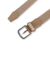 Braided beige fabric belt with leather accents; silver metal buckle; "BOSS" logo in white on the leather tab.
