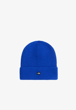 Jaskrawo niebieska dzianinowa czapka typu beanie z podwiniętym rondem i małym czarno-białym logo North Face na środku z przodu.