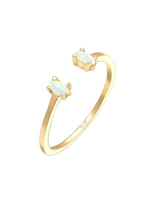 Delicate open-ended gold ring with two small pear-shaped opal stones set opposite each other on a thin band.