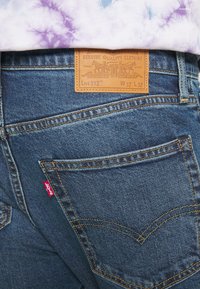 Levi's® 512® SLIM TAPER - Calças de ganga justas - medium indigo stonewash