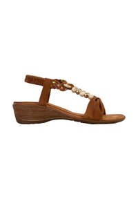 Sandale en suède marron avec une bride de orteil nouée, des accents multicolores tressés et un talon compensé. Présente des perles décoratives le long des brides.