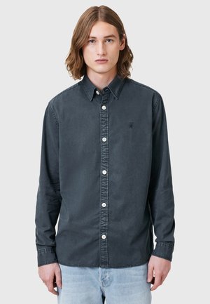 Dark gray long-sleeve shirt made of cotton, featuring a button-down collar, front buttons, and subtle logo on the chest.