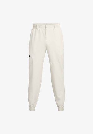 Lichtbeige joggerbroeken met een elastische tailleband, zijzakken en geribde manchetten; voorzien van een zwart logo accent op de linkse heup.