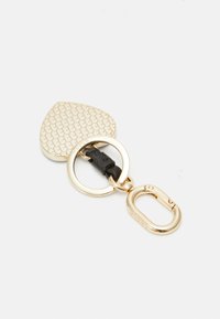 Gold keychain with a heart-shaped, scale-patterned pendant, attached to a black strap and circular metal ring with a clasp.