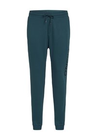 Turkusowe jogger pants wykonane z miękkiego materiału, z elastycznym pasem na sznurku i ściągaczami na końcach nogawek. Po bokach czarny nadruk logo, który kontrastuje z kolorem spodni.