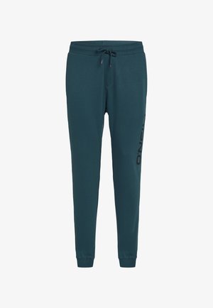 Teal jogger pants made of soft fabric, featuring a drawstring waist and ribbed cuffs. Side logo print in black for contrast.