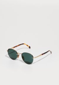 Ochelari de soare rotunzi cu lentile de culoare verde închis, rame din metal aurit și brațe cu model țestoasă. Prezintă un design cu pod dublu.