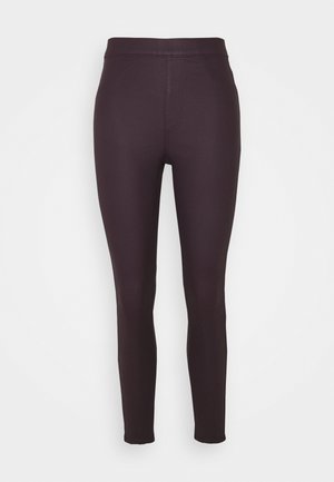 Dunkellila Leggings aus dehnbarem Material, mit glatter Textur, hohem Bund und ohne sichtbare Verschlüsse oder Taschen.