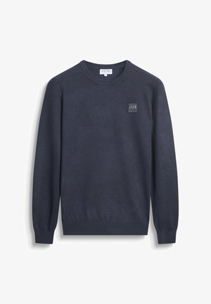 Marineblauwe gebreide trui met lange mouwen, ronde halslijn en geribbelde manchetten. Bevat een zwart logo-oproep op de borst.