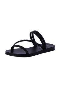 Sandalias planas negras con dos correas texturizadas y con abalorios que se cruzan sobre una suela minimalista, con un acabado mate suave.