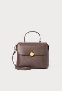 Brown leather handbag with a structured shape, gold hardware, a top handle, and a detachable shoulder strap. Featuring a prominent round clasp.