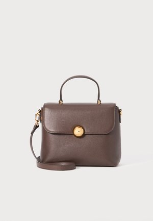 Brown leather handbag with a structured shape, gold hardware, a top handle, and a detachable shoulder strap. Featuring a prominent round clasp.