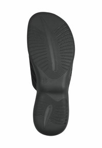 Semelle de chaussure noire avec motifs de grip texturés, présentant une forme lisse et courbée ainsi que des marques de taille. Bord renforcé pour une durabilité accrue.
