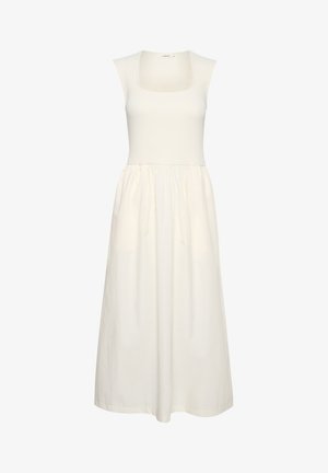 Valge kleit ruudukujulise kaelusega, ribatud kehaosaga ja vooluva seelikuosaga. Valmistatud kergetest kangast, millel on sile tekstuur.