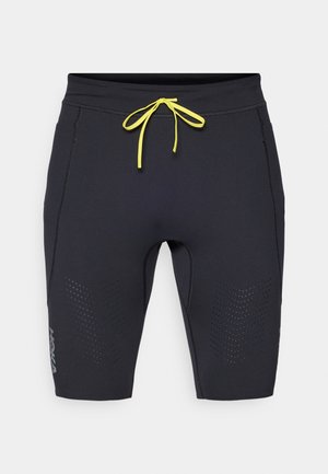 Black athletic shorts with a fitted design. Features yellow drawstring, perforated accents on the sides, and HOKA logo near the hem.
