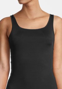 Black tank top made of smooth fabric, featuring a square neckline and thin straps. The design is fitted, emphasizing a streamlined shape.