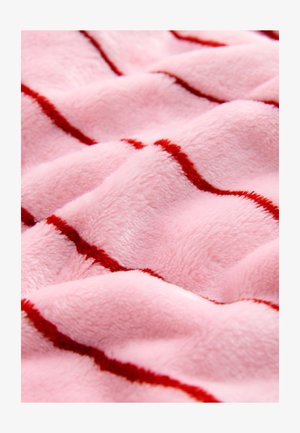Pink plush fabric with a soft texture, featuring wavy red stripes running across the surface. Smooth and inviting appearance.