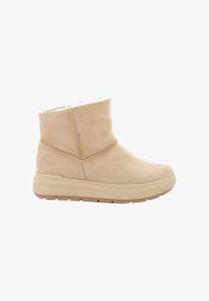 Stivaletto beige in camoscio con suola spessa in gomma e fodera morbida in pile, progettato per il comfort nelle giornate fredde e per un uso casual.