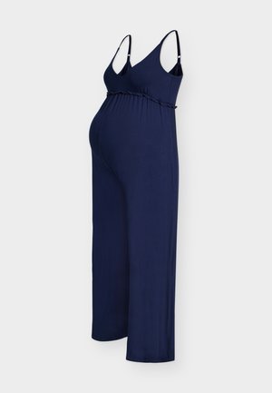 Granatowy bezrękawnikowy kombinezon ciążowy z regulowanymi ramiączkami, wysokim stanem oraz szerokimi nogawkami na białym tle.