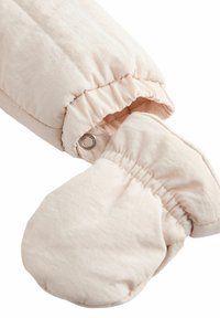 Kergelt polsterdatud heledad beežid kindaid, elastse randmeosa ja nööbi kinnitusmehhanismiga, et need paremini paigal püsiksid. Valmistatud pehmest, struktuursed kangast.