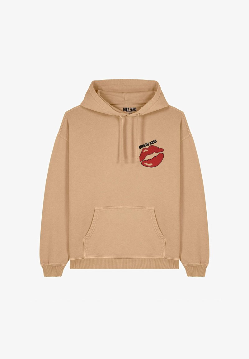 Hoodie beige en coton, doté d'une poche kangourou à l'avant et d'un graphique de lèvres rouges avec le texte "French Kiss" sur la poitrine à gauche.