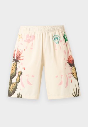 Short beige clair avec ceinture élastique, décoré de motifs de cactus verts et rouges ainsi que de crânes pastel pixelisés sur les côtés.