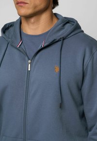 U.S. Polo Assn. OTTO - Majica s kapuljačom i patentnim zatvaračem - vintage indigo