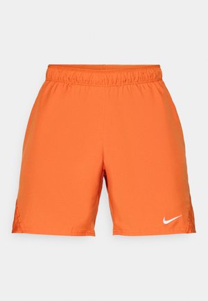 Shorts atletici portocalii cu talie elastică. Confectionați dintr-un material neted, având un logo alb Nike în partea stângă jos.