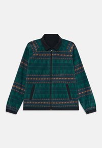 Groene en marineblauwe zip-up jas met geometrische patronen, zwarte kraag, zwarte elastische manchetten en zijzakken met zwarte bies.