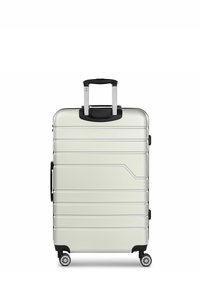 Silver hard-shell suitcase with vertical grooves, retractable black handle, two wheels, and a side handle. Smooth texture and minimalist design.