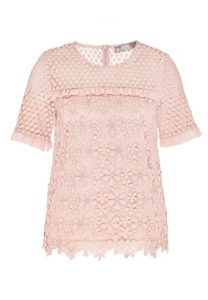 Blouse courte à manches courtes en dentelle rose clair avec motifs floraux, partie supérieure transparente au niveau de la poitrine et des manches, bordure à volants au col et aux poignets, fermeture éclair dans le dos.