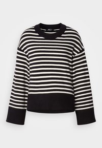 Sweater às riscas em preto e branco, com decote redondo, corte solto e punhos canelados, feito de um material de malha macio.