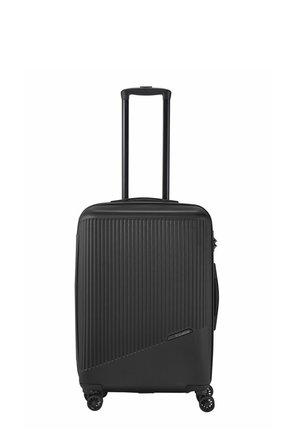 Black hard-shell suitcase with vertical ribbed texture, telescopic handle, and four smooth-rolling wheels. Side handle and zipper closure.